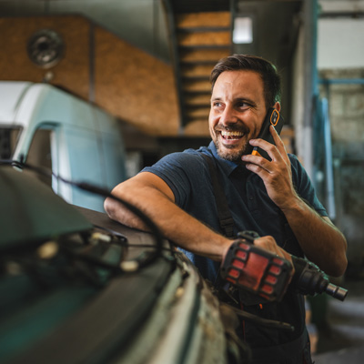 Mechanic taking a customer call