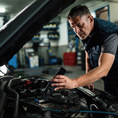 Mechanic working on a car engine